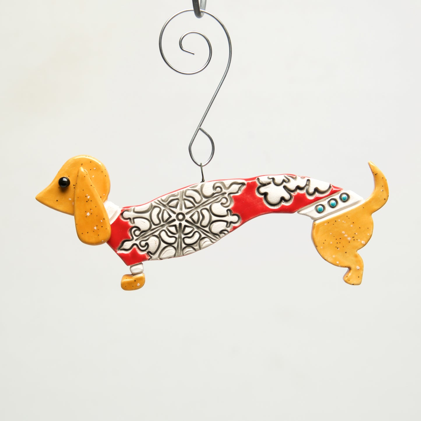 Doxy in Sweater Clay handmade ornament by Sally Scott - © Blue Pomegranate Gallery