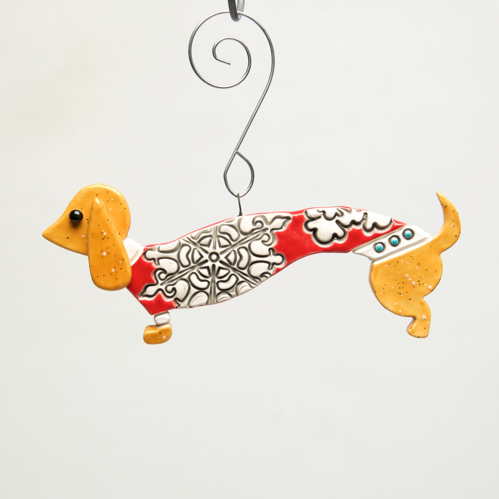 Doxy in Sweater Clay handmade ornament by Sally Scott - © Blue Pomegranate Gallery